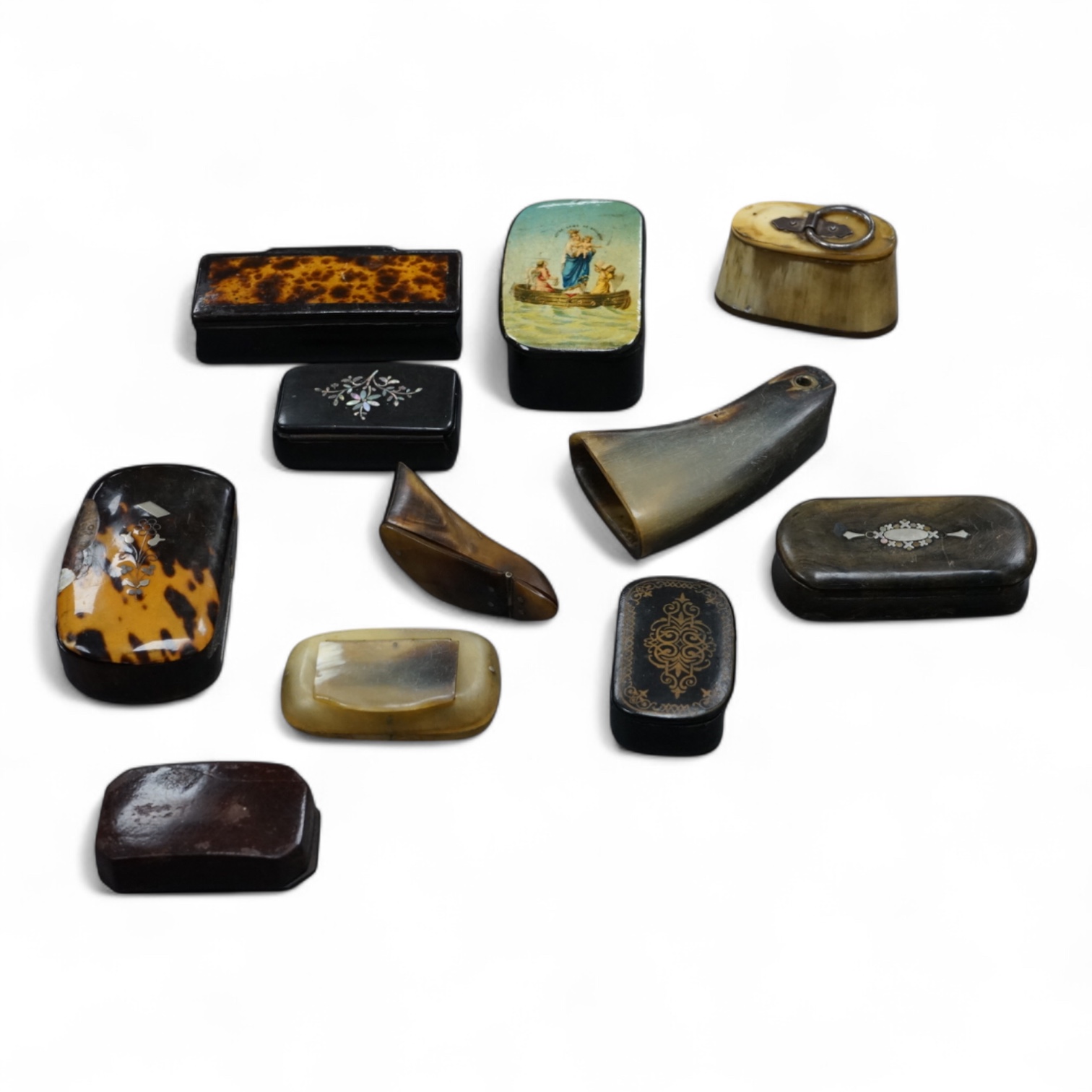 Eleven assorted horn, lacquered and ebony snuff boxes, the majority 19th century, largest 8.5cm long.